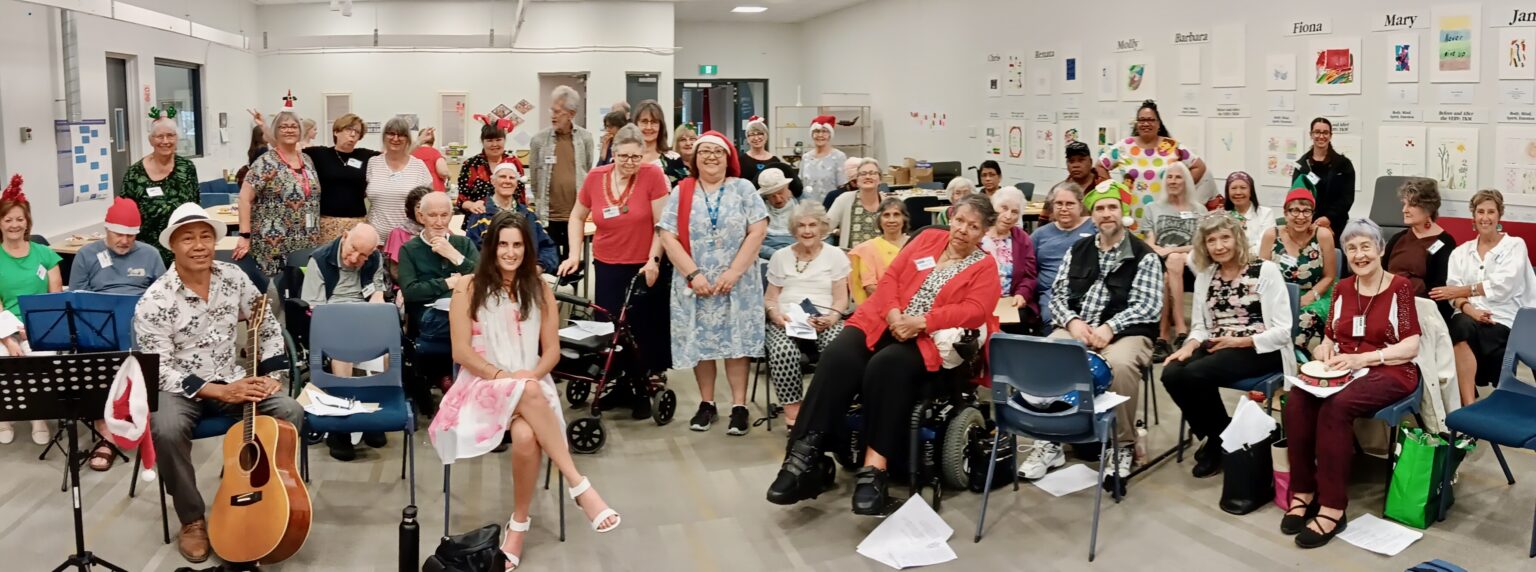 CeleBRation Choir Christmas party 2024 - smiling and looking very relaxed after singing and afternoon tea!