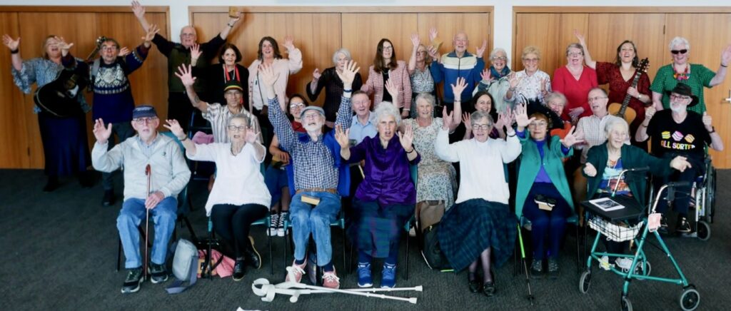 SoundsWell Singers - cheering and smiling at the camera